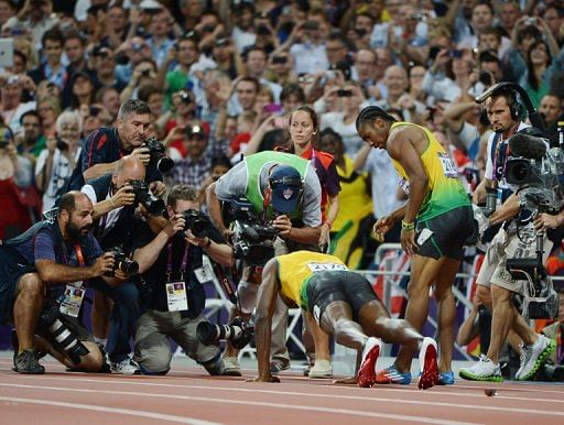 Jamaica's Usain Bolt does push ups after winning the men's 200m final